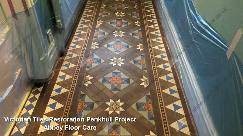 Original patterned Victorian hallway tiles in Penkhull revealing embedded residue and muted colour