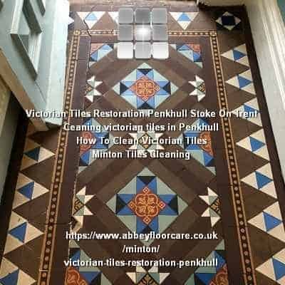 Victorian hallway tiles in Penkhull uncovered after carpet removal, displaying dark residue and uneven wear